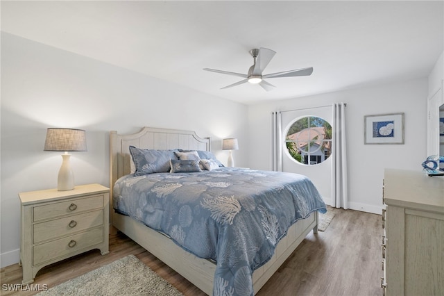 bedroom featuring ceiling fan and light hardwood / wood-style floors