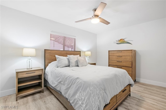 bedroom featuring ceiling fan and light hardwood / wood-style flooring