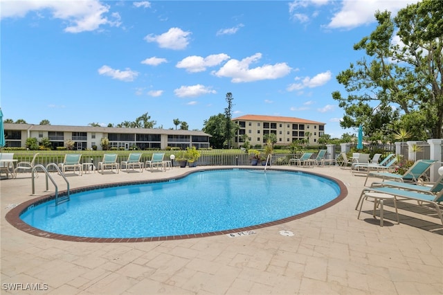 view of swimming pool featuring a patio