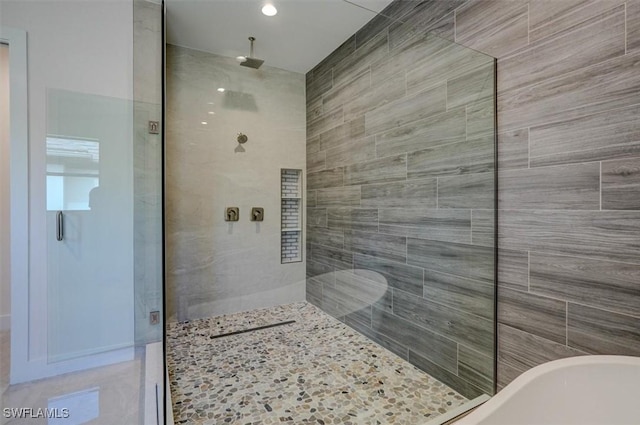 bathroom featuring plus walk in shower