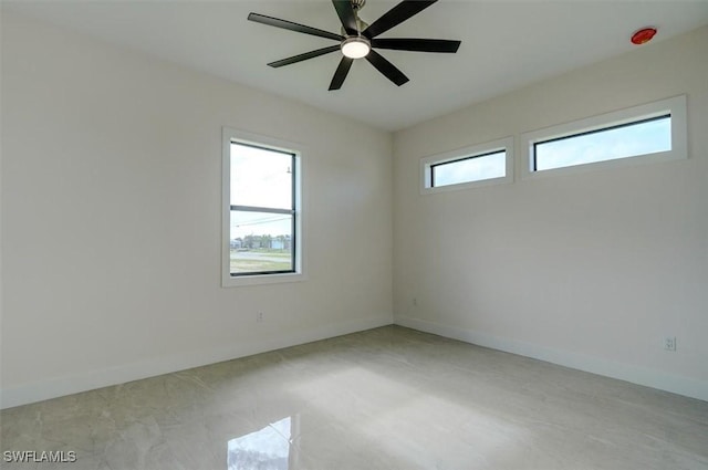 spare room with ceiling fan