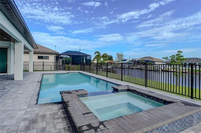 view of swimming pool featuring an in ground hot tub and a water view