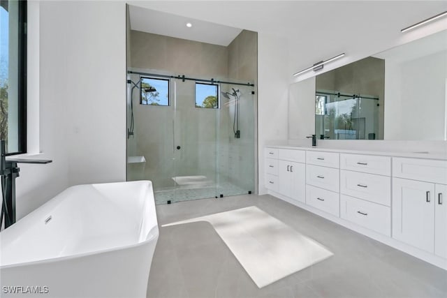 bathroom with vanity and plus walk in shower