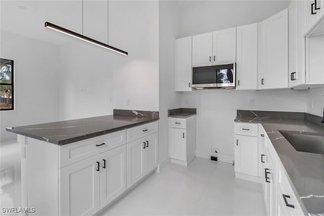 kitchen with sink and white cabinets