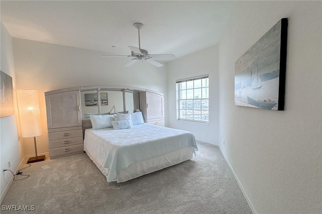 bedroom featuring ceiling fan and light colored carpet