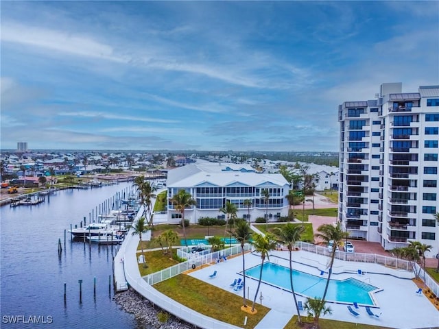 birds eye view of property with a water view