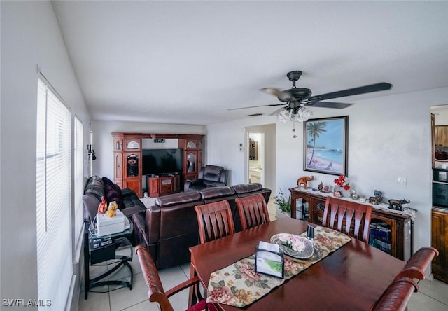 dining room with ceiling fan and light tile patterned flooring