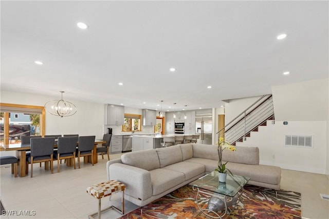 living room with a chandelier and a wealth of natural light