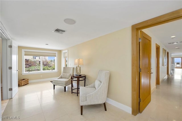 living area with light tile patterned floors