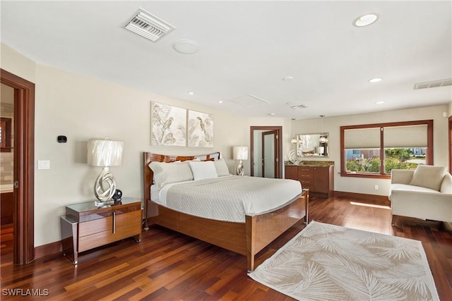 bedroom with dark wood-type flooring