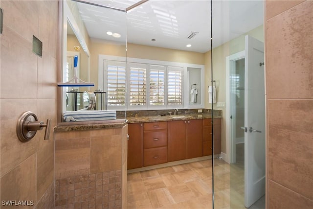 bathroom featuring vanity and walk in shower