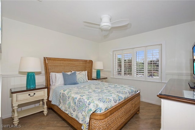 bedroom with ceiling fan and dark hardwood / wood-style flooring