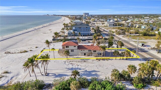 aerial view featuring a water view and a view of the beach