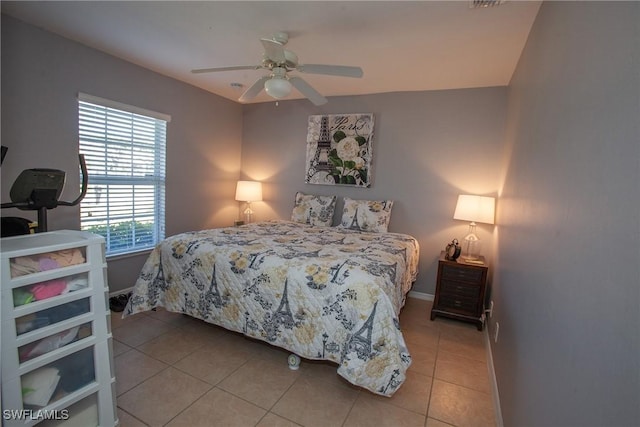 tiled bedroom with ceiling fan