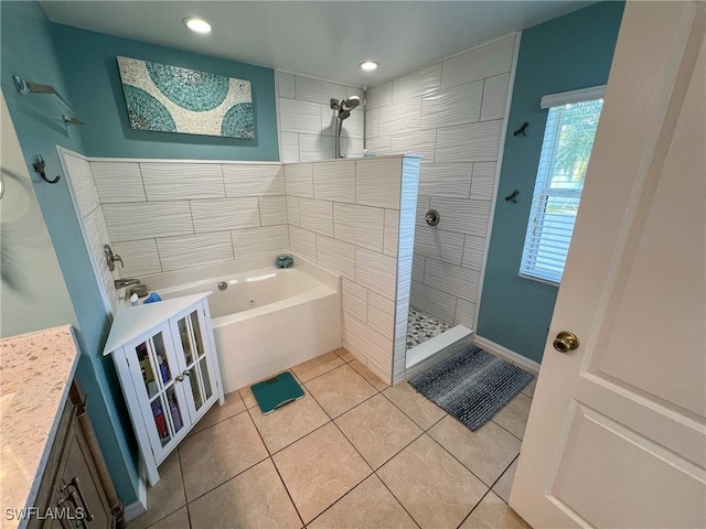 bathroom with tile patterned flooring, vanity, and independent shower and bath