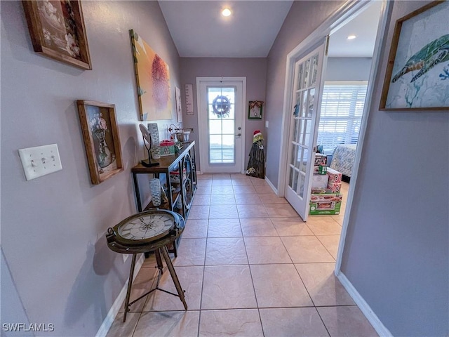 entryway featuring light tile patterned floors