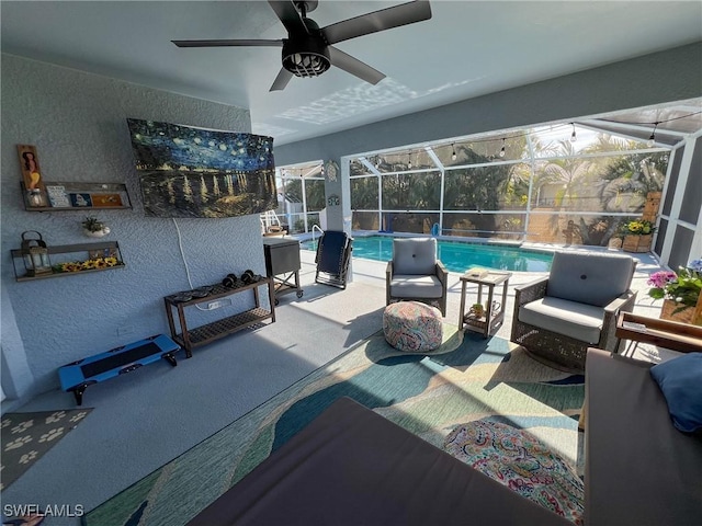 view of patio / terrace featuring a lanai and ceiling fan