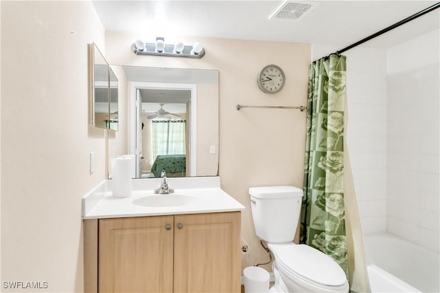 full bathroom with shower / bathtub combination with curtain, vanity, and toilet