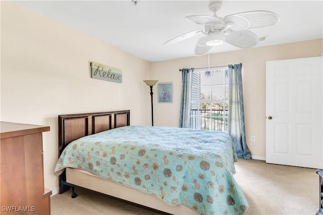 bedroom featuring ceiling fan and light colored carpet