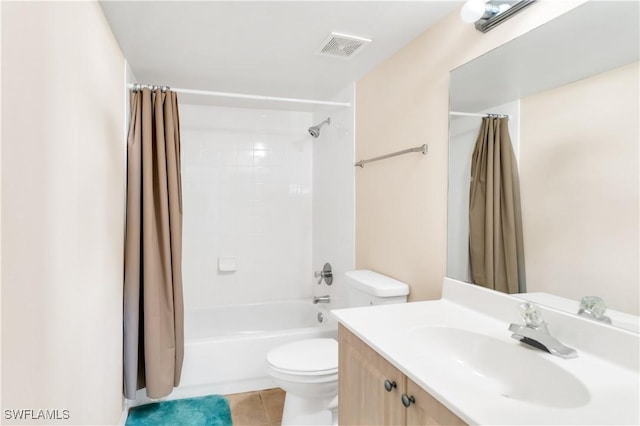 full bathroom with tile patterned floors, vanity, toilet, and shower / tub combo