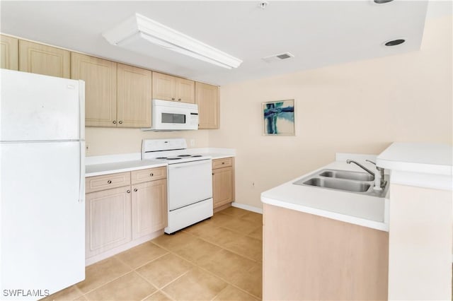 kitchen with sink, light tile patterned floors, white appliances, and light brown cabinets