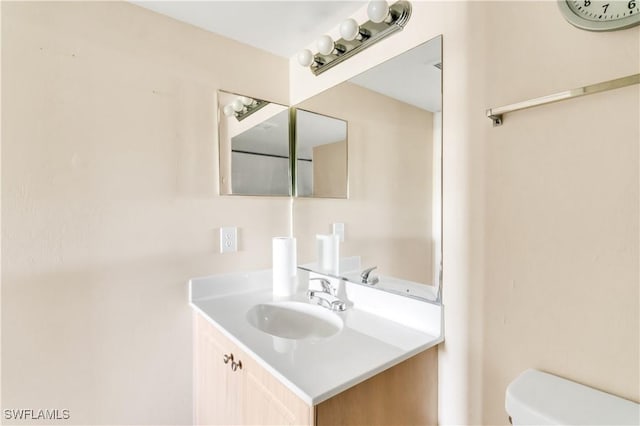 bathroom with vanity and toilet