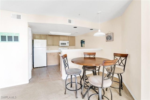 dining room featuring light tile patterned floors