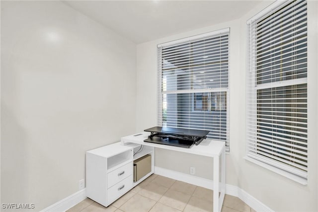 home office featuring light tile patterned flooring