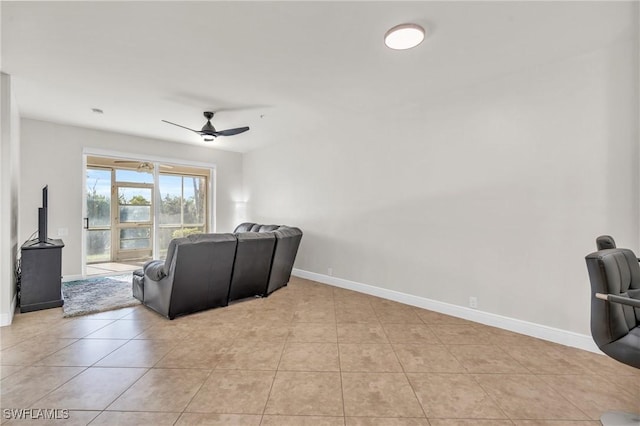 tiled living room with ceiling fan