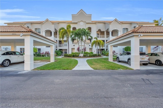 mediterranean / spanish-style house with a front lawn