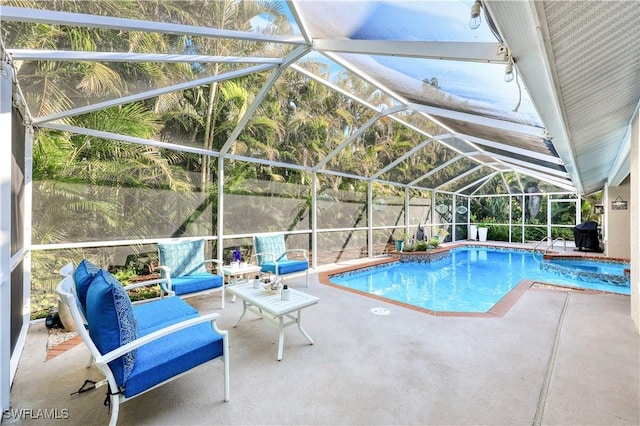 view of swimming pool with a patio area, a lanai, and a grill