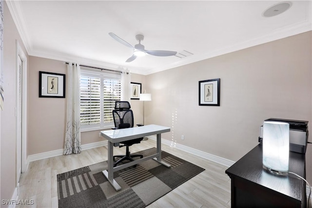 office with ceiling fan, crown molding, and light hardwood / wood-style floors