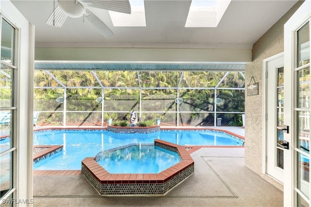 view of swimming pool with ceiling fan and a patio