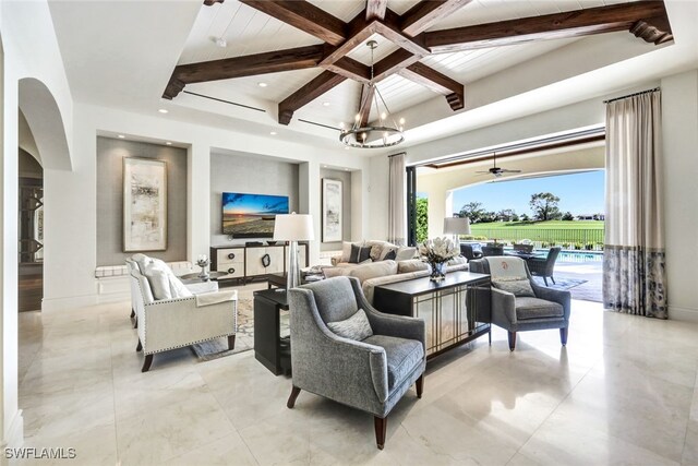 living room featuring ceiling fan with notable chandelier, beamed ceiling, and coffered ceiling