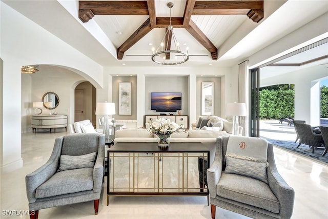 living room featuring beamed ceiling, a notable chandelier, and wood ceiling