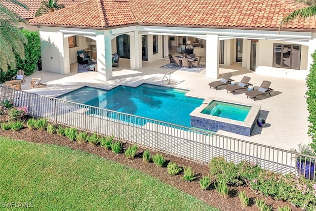 view of swimming pool with a patio area, an outdoor living space, and an in ground hot tub