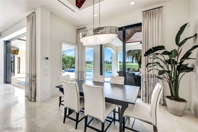 dining space featuring an inviting chandelier