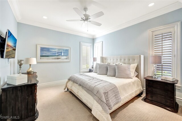 carpeted bedroom with ceiling fan and crown molding