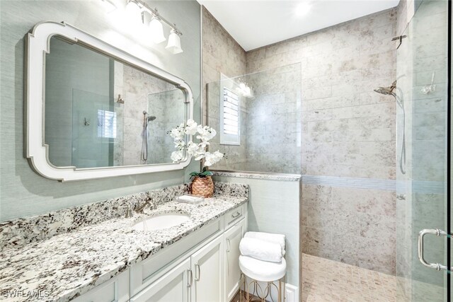 bathroom featuring vanity and walk in shower