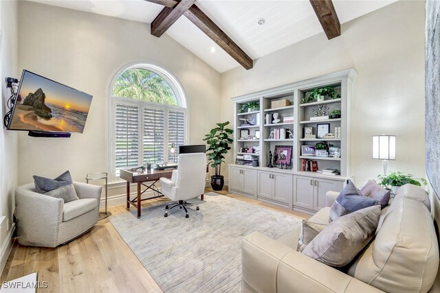 home office with vaulted ceiling with beams and light hardwood / wood-style flooring