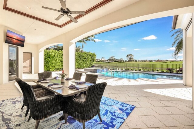 view of patio with ceiling fan and a fenced in pool