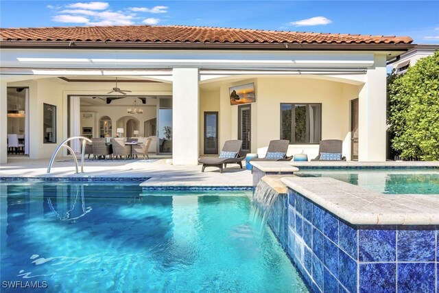 view of pool featuring a patio area, pool water feature, and ceiling fan