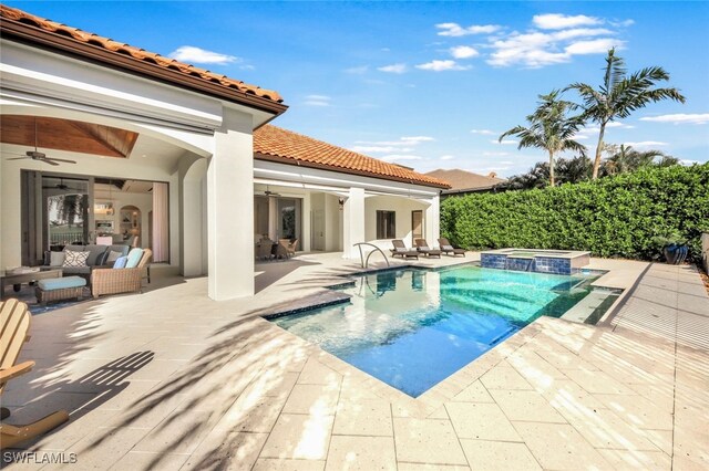 view of swimming pool featuring outdoor lounge area, ceiling fan, an in ground hot tub, and a patio