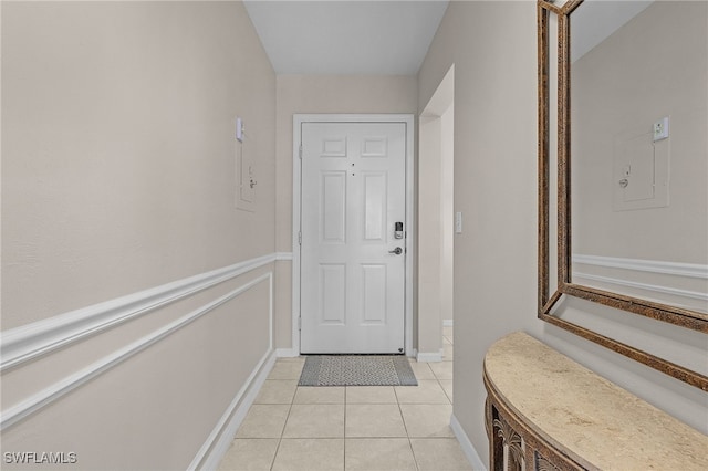 doorway with light tile patterned floors