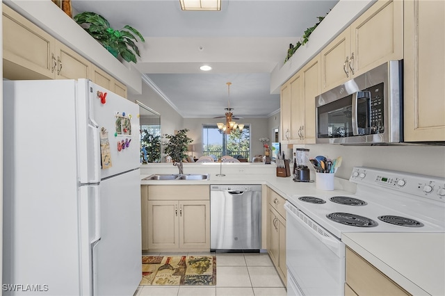 kitchen featuring ceiling fan, sink, stainless steel appliances, crown molding, and light tile patterned floors