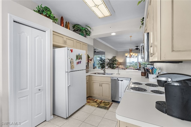 kitchen featuring dishwasher, sink, light tile patterned floors, white fridge, and a chandelier