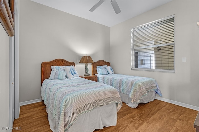 bedroom with hardwood / wood-style flooring and ceiling fan