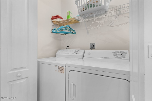 laundry room featuring washing machine and clothes dryer