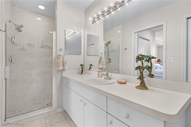 bathroom with vanity, tile patterned floors, and a shower with shower door