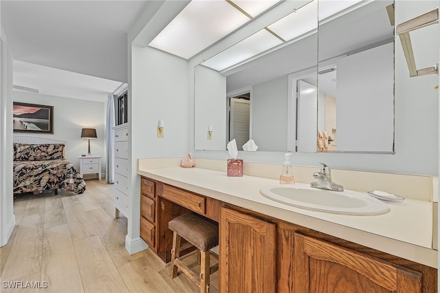 bathroom with wood-type flooring and vanity